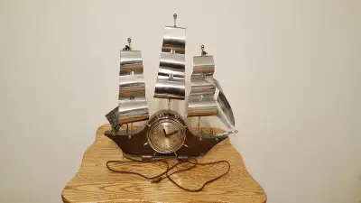 Vintage model ship with clock, View more
