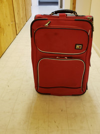 "TOMMY SPIRIT"  brand, soft-sided luggage.
