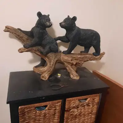 Stamped canadian wilderness statues.. One is a floor lamp Very heavy