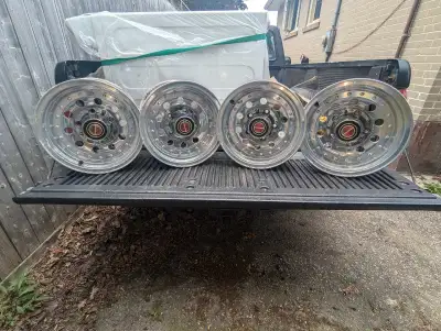 4 stock aluminum 15"/ 5bolt rim's came off a 1992 Ford F-150 and will fit most OBS pickup trucks. As...