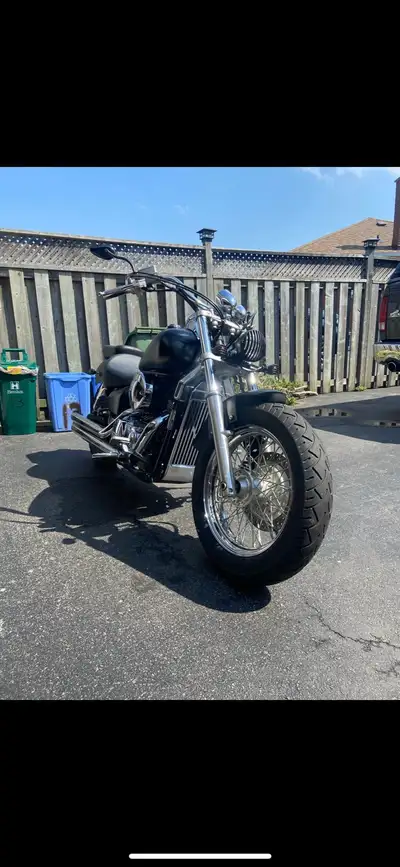 This 2004 Honda Shadow 750 offers a reliable and classic cruiser experience with its 750cc engine an...