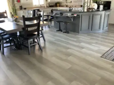 Approximately 360 Sq Ft. of vinyl click flooring tiles. 24” long X 12” wide. The tiles are in like n...