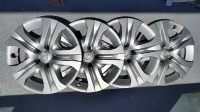 I'm selling a set of four used Toyota wheel covers, each measuring 17 inches. These hubcaps show sig...