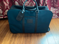 Longchamp . Authentic . Carry on , duffle bag . With wheels .