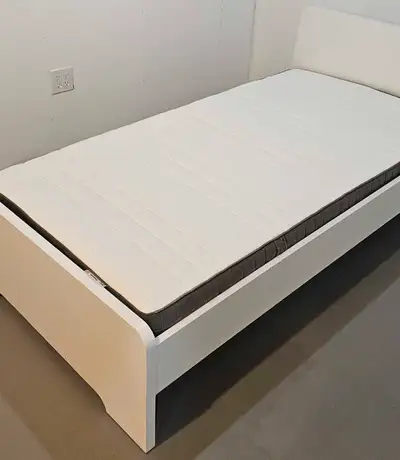 Twin bed frame and mattress. Was in a spare room and never used. BOTH FOR $200.