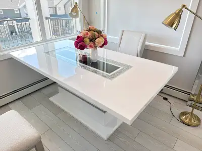 Elevate your dining experience with this luxurious dining table from Brick Furniture. The table feat...