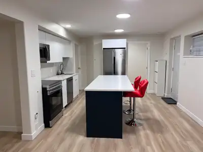 Modern 2-Bedroom   Den Walk-Out Basement Suite in Heritage Mount