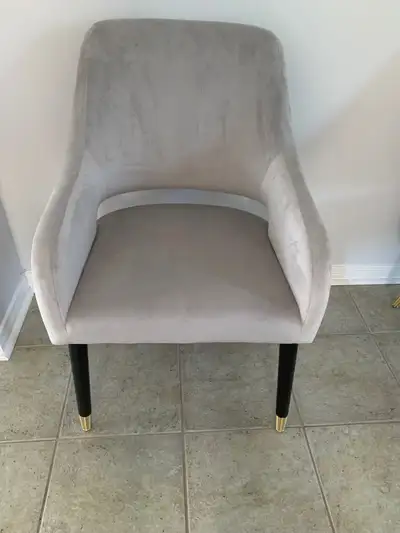 Enhance your dining space with these elegant dining chairs. These chairs feature a soft, light grey...