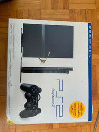 PlayStation 2 with games and memory card