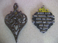 Attractive pair of CAST IRON TRIVETS for hot items