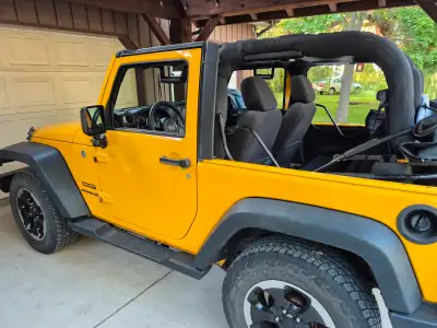 Selling this Cool 2015 Yellow Jeep Wrangler for my daughter. She is the original, only owner. Ice co...