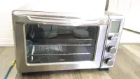 Oster toaster oven / grill pan four , model TSSTDVFL1-033 , 1400