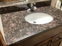 Quartz Vanity top with under mount sink and Delta taps