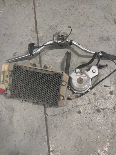 Selling Polaris Predator 500 parts, possibly fit 2003-07. Grips Rad with fan and cover Stator cover...