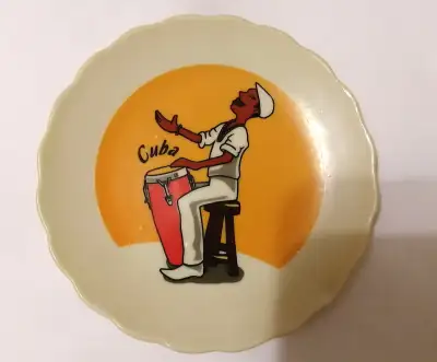 Vintage autentica cuba man playing drum small dish, View more