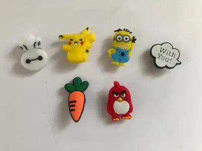 Six Crocs charms for sale, four pop culture collectible charms Pikachu, Baymax, Minion and Angry Red...