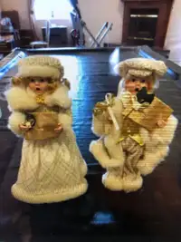 Set of male and female Decorated porcelain Christmas dolls