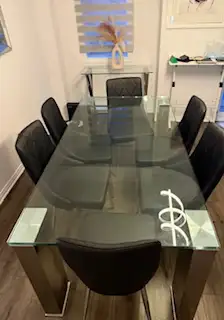 Glass dinning table seats 6 purchased from Mobilia, View more