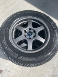 18” Elderbrus wheels. Michelin ice X tires. 