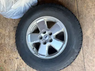 Full set studded winter tires on rims 235 70R16