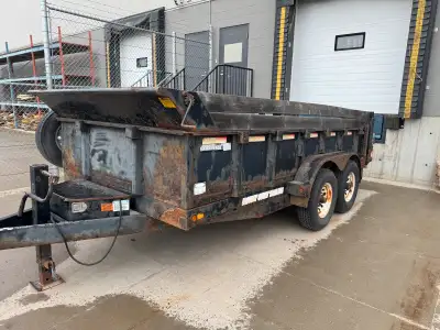 14ft dump trailer Little bit of rust but pulls straight New tire 1 year ago (low miles on the)