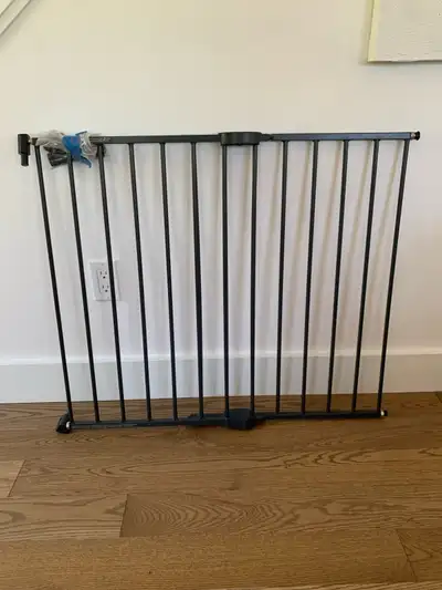 Solid metal baby gate for sale. Screws into the wall and gate swings out. Expands 36” L x 28 1/2” H....