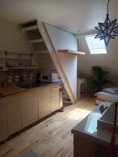 Beautiful bright attic room with kitchenette, washer and drier and lots of light storage space. All...