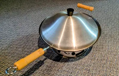 Well cared for and in good condition. Includes lid and base. 14" flat bottom