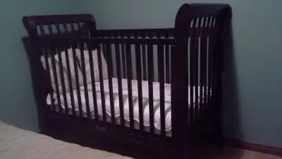 Beautiful, solid wood crib with mattress and new mattress cover.