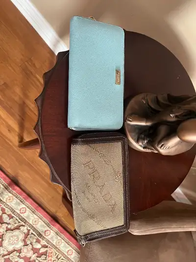 2 wallets .Prada, Kate Spade, View more