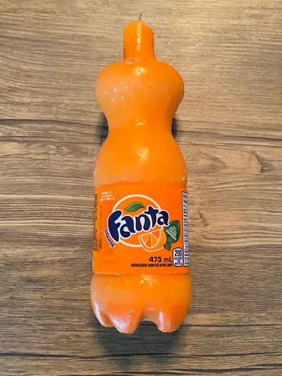 Offered is a very cool candle in the shape of a FANTA orange bottle. It looks exactly like an actual...