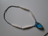 necklace with long beads and tourquoise stone