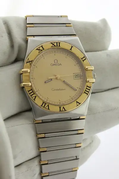 Make: Omega Model: Constellation Movement: Swiss Quartz Case: 18K Yellow Gold & Stainless Steel Brac...