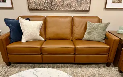 Beautiful brown, full leather (seats, arms, back) couch with two reclining seats. The back is statio...