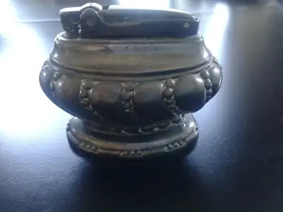 Silverplate, needs cleaning, uses flints and lighter fluid. Produced in 1930 to 1950s. FYI I have a...