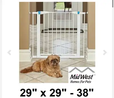 Keep your furry friends safe and sound with this Midwest Homes for Pets steel pet gate! Measuring 29...