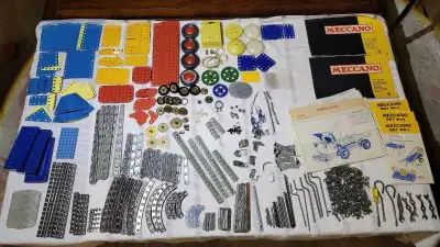 Big lot of toy parts, pieces, tools and booklets. You get everything in the pictures. There's old En...