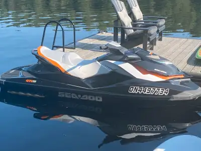 2013 Seadoo GTI 155 SE Three seater with 145 hours. New cover, shore ramp and Jet Master trailer inc...