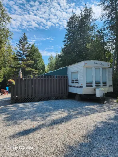 Lot fees paid until May 2026. 38 feet long, 12 feet wide 4-piece bathroom Master bedroom with a quee...