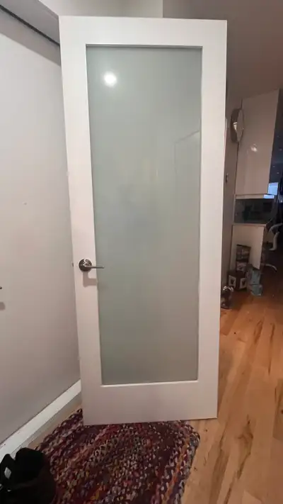 Giving away a used interior door with a frosted glass panel, perfect for adding privacy while still...
