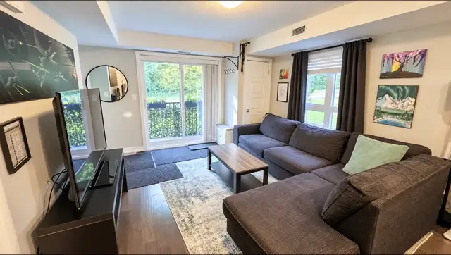 Bright 1- Bedroom Main level Condo | Parking Included