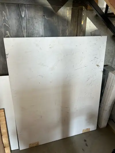 45” x 38” laminated plywood. 1 1/2” thick. Painted white.