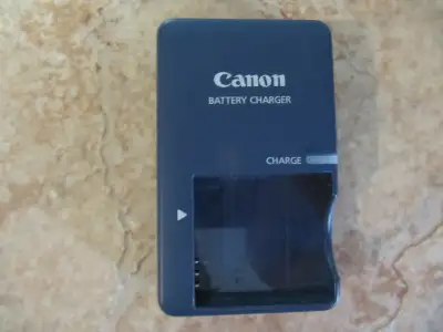 Up for sale is a Canon Model CB-2LVG 4.2 Volt Battery Charger designed for NB-4L Battery. Part of an...