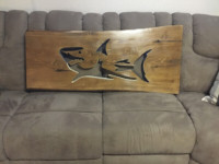 Chainsaw carved shark on live edge cedar.