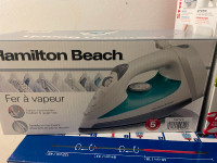 Brand new unopened Hamilton beach steam iron white!