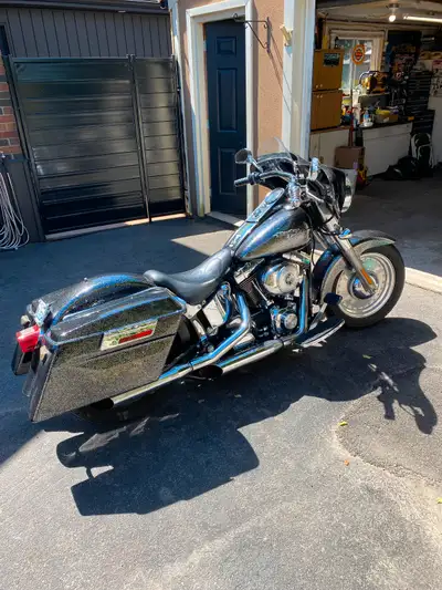 Heritage Softail classic. Fat boy fenders and wheels with like new tires. Hard bags and batwing fair...