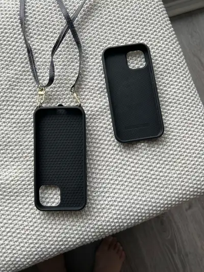 Elevate your iPhone 14 with this gently used phone case, complete with a convenient strap. This styl...