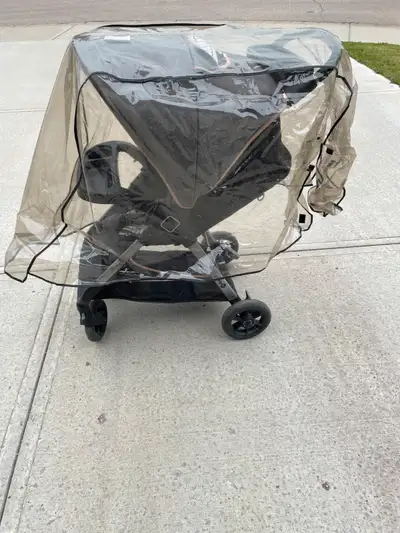 Stroller with rain covering, View more