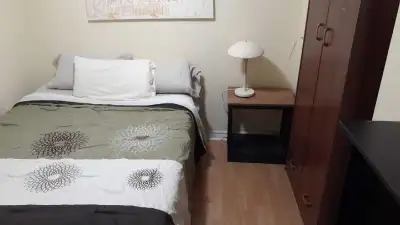 The photos showcase a furnished room available for rent, featuring a single bed, wardrobe, bedside t...