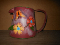 metal watering can with decor